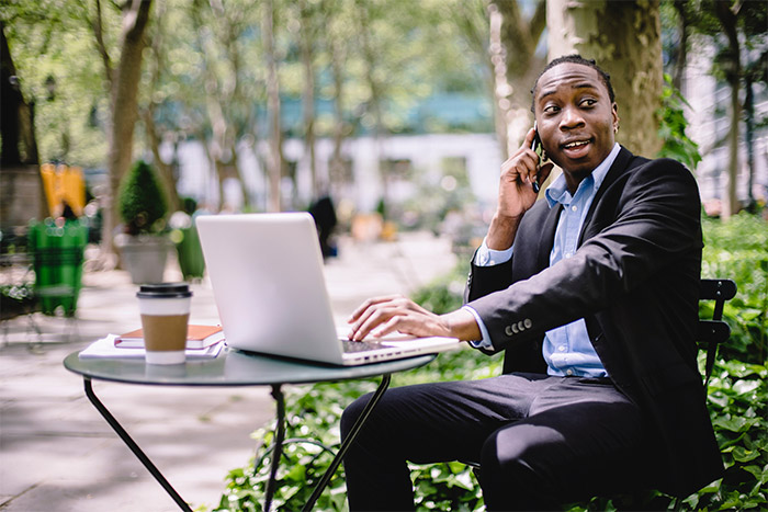 african-corporate-business-man-wearing-a-suit-talking-on-the-phone